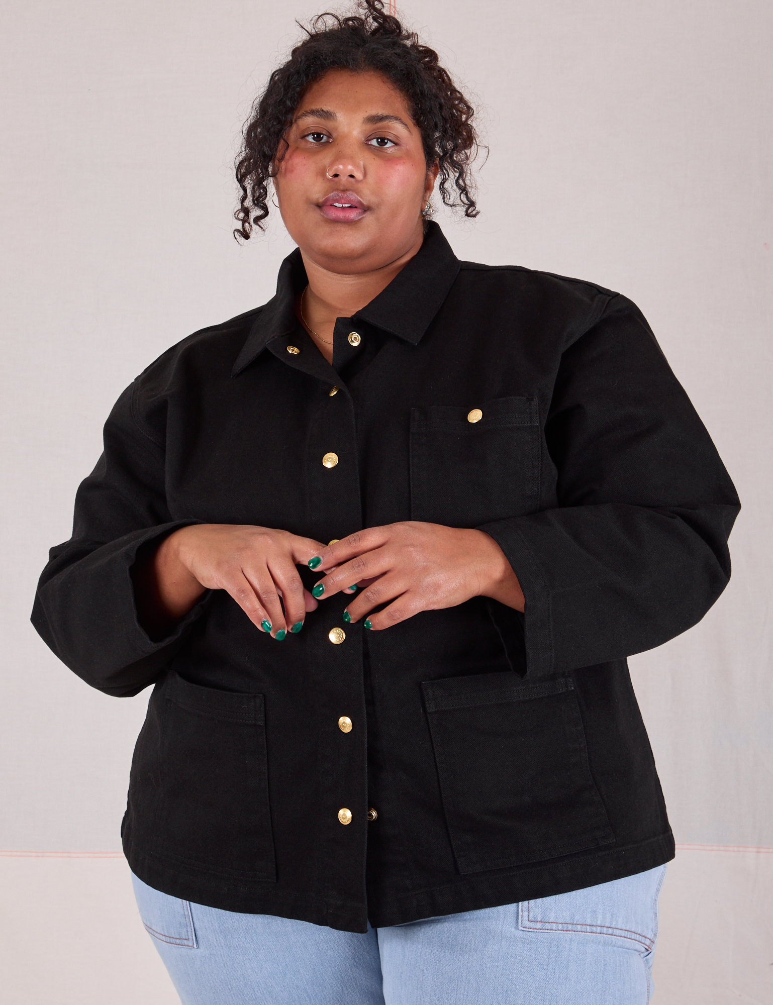 Morgan is wearing a buttoned up Denim Work Jacket in Basic Black