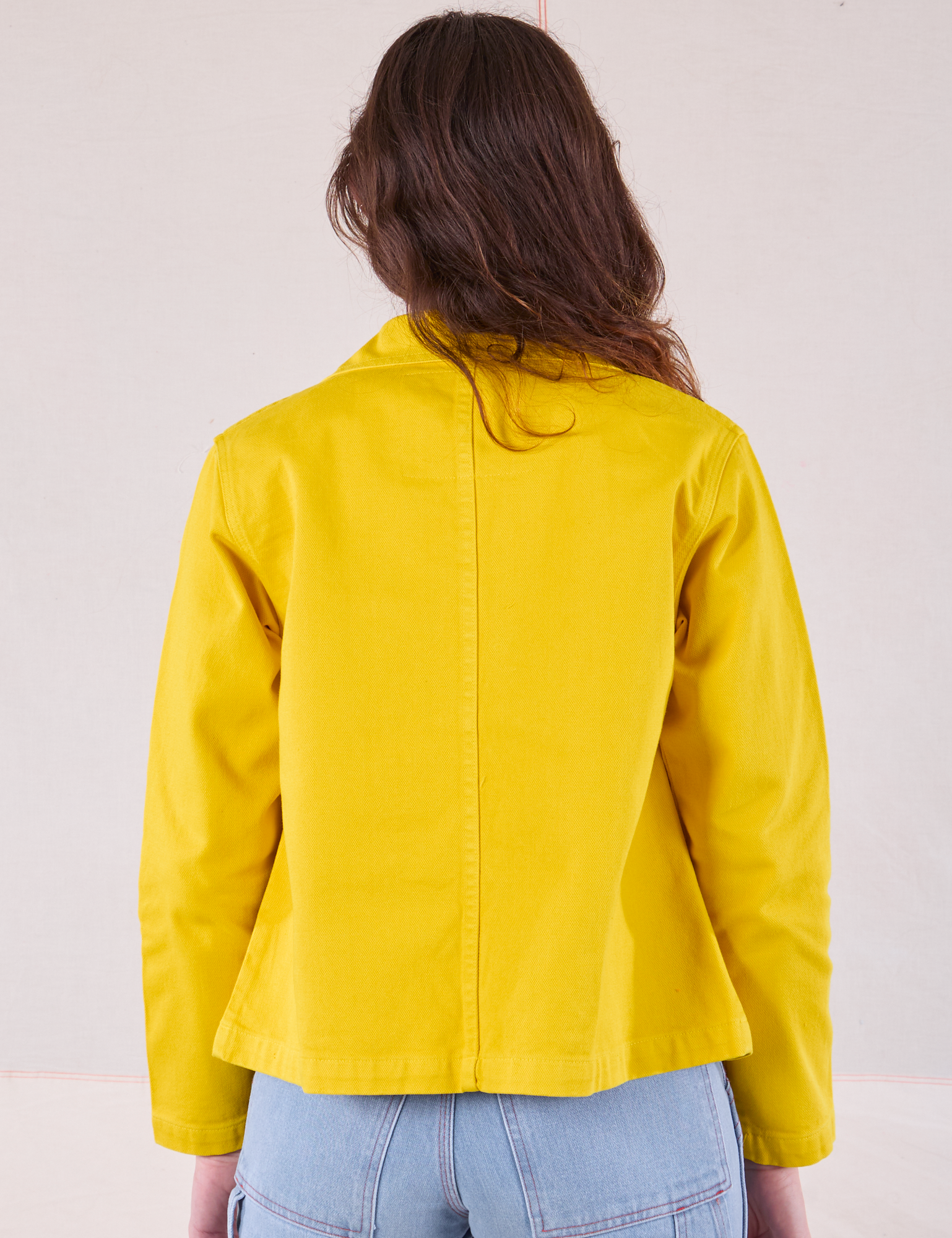 Denim Work Jacket in Golden Yellow back view on Alex