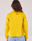 Denim Work Jacket in Golden Yellow back view on Alex