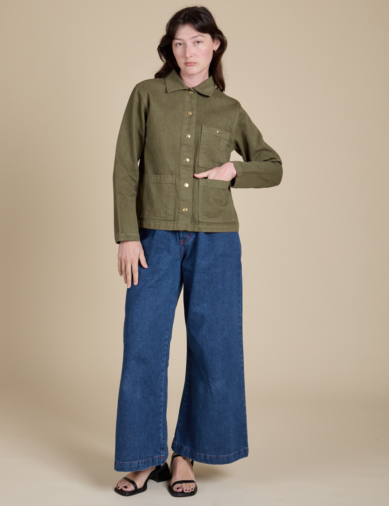 Denim Work Jacket in Surplus Green and dark wash Indigo Wide Leg Trousers on Alex