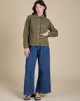 Denim Work Jacket in Surplus Green and dark wash Indigo Wide Leg Trousers on Alex