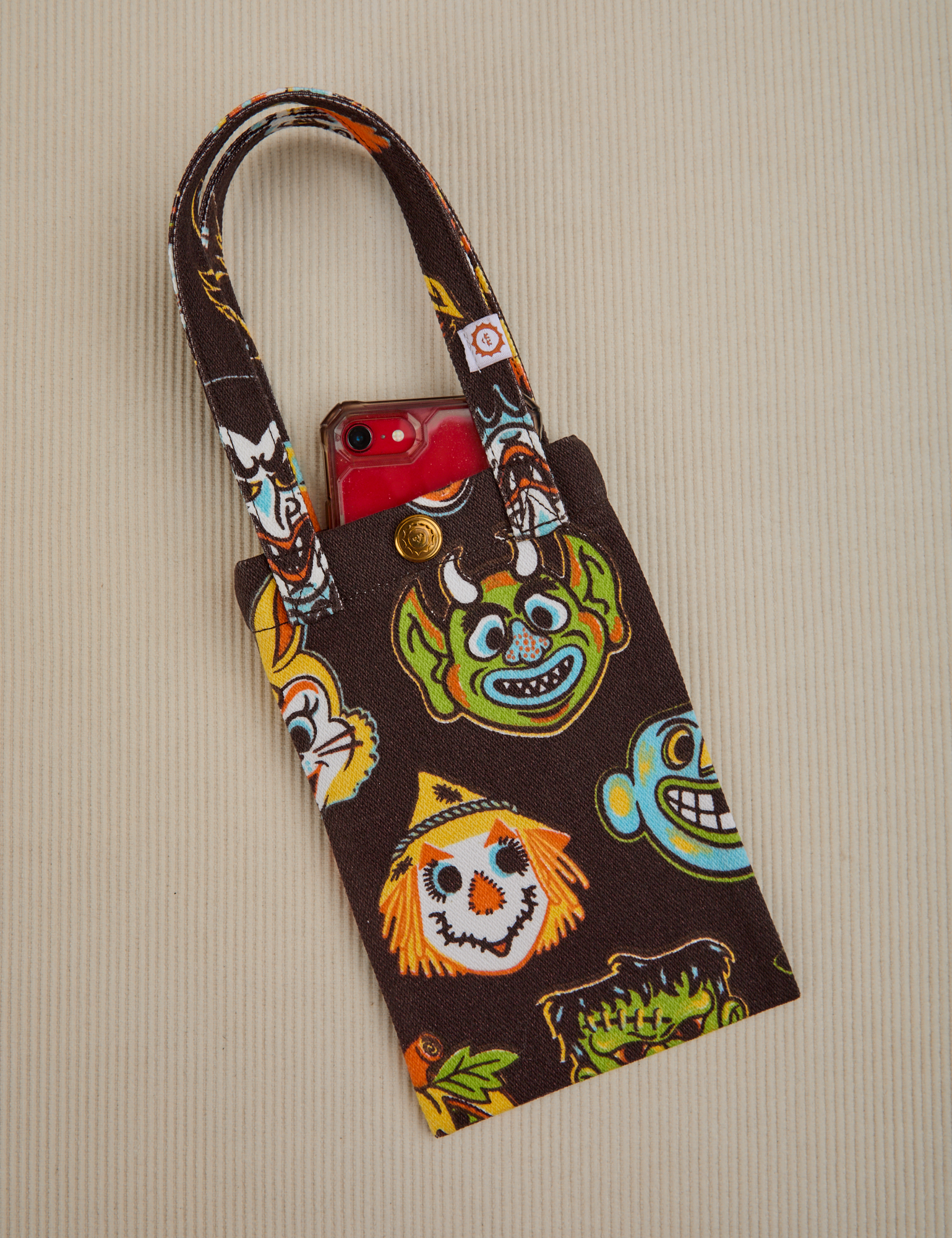 Halloween Masks Cell Phone Tote with phone tucked in