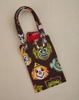 Halloween Masks Cell Phone Tote with phone tucked in