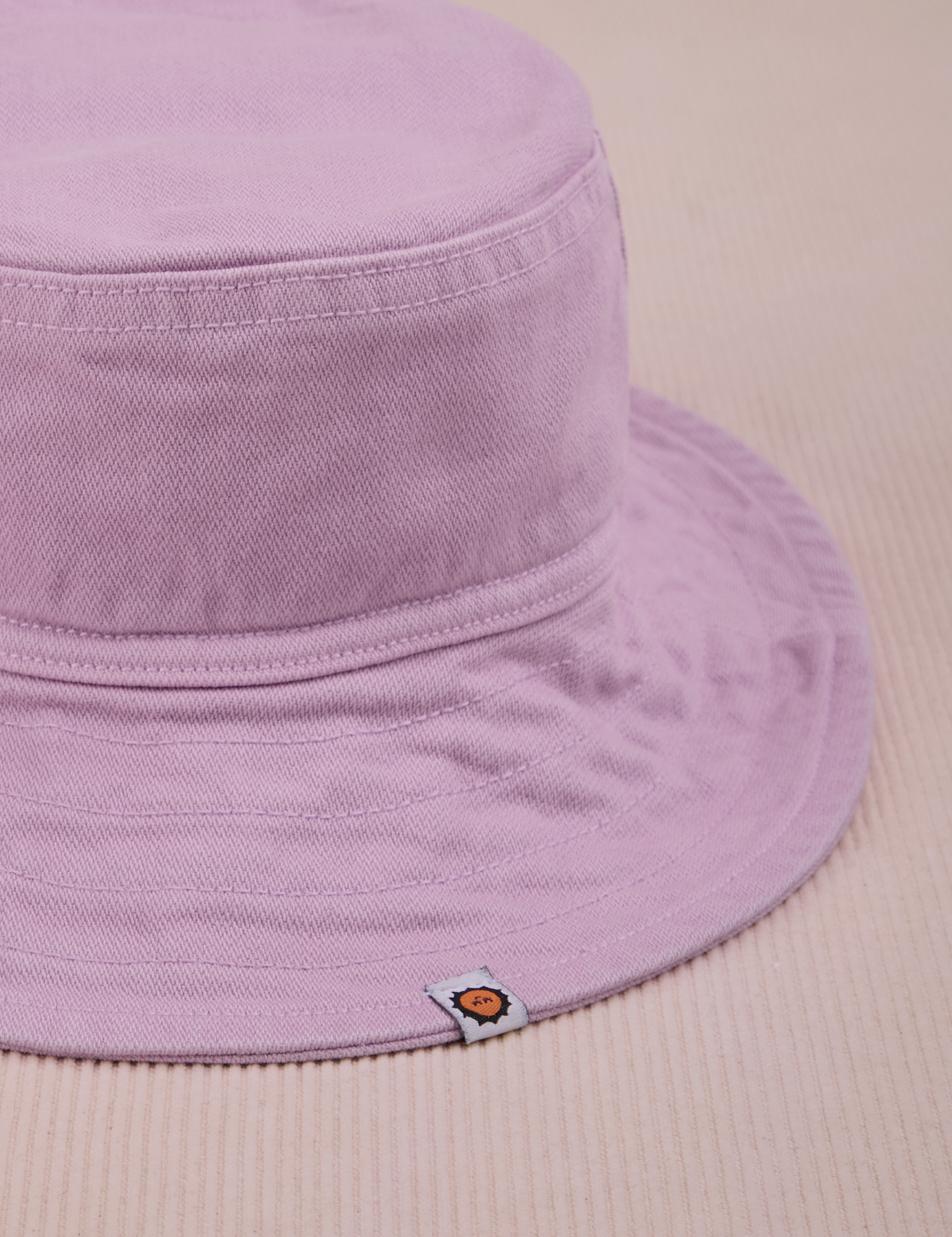 Wide Brim Denim Bucket Hat in Lilac close up