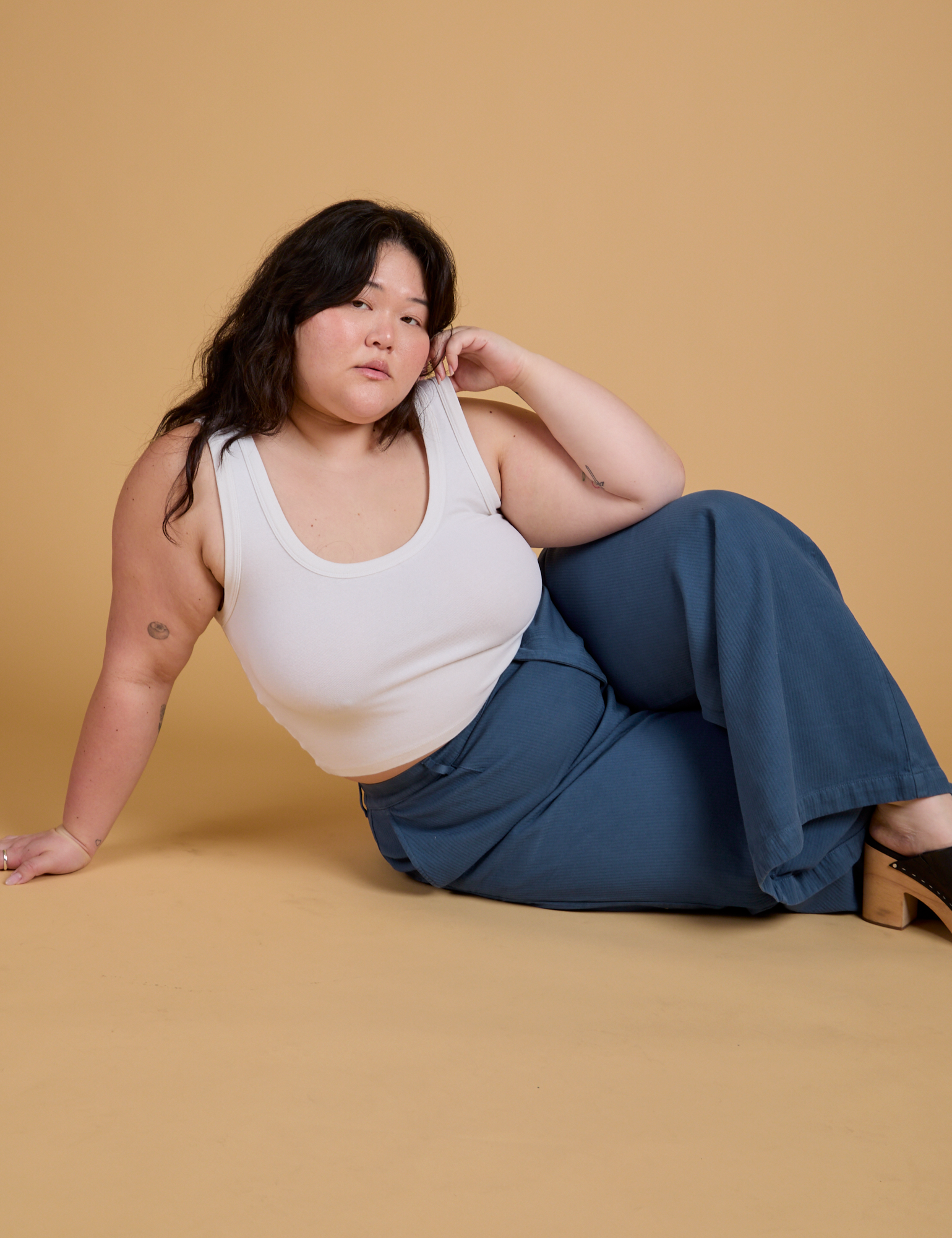 Ashley is wearing Heritage Wide Leg Trousers in French Blue and Cropped Tank in Vintage Tee White