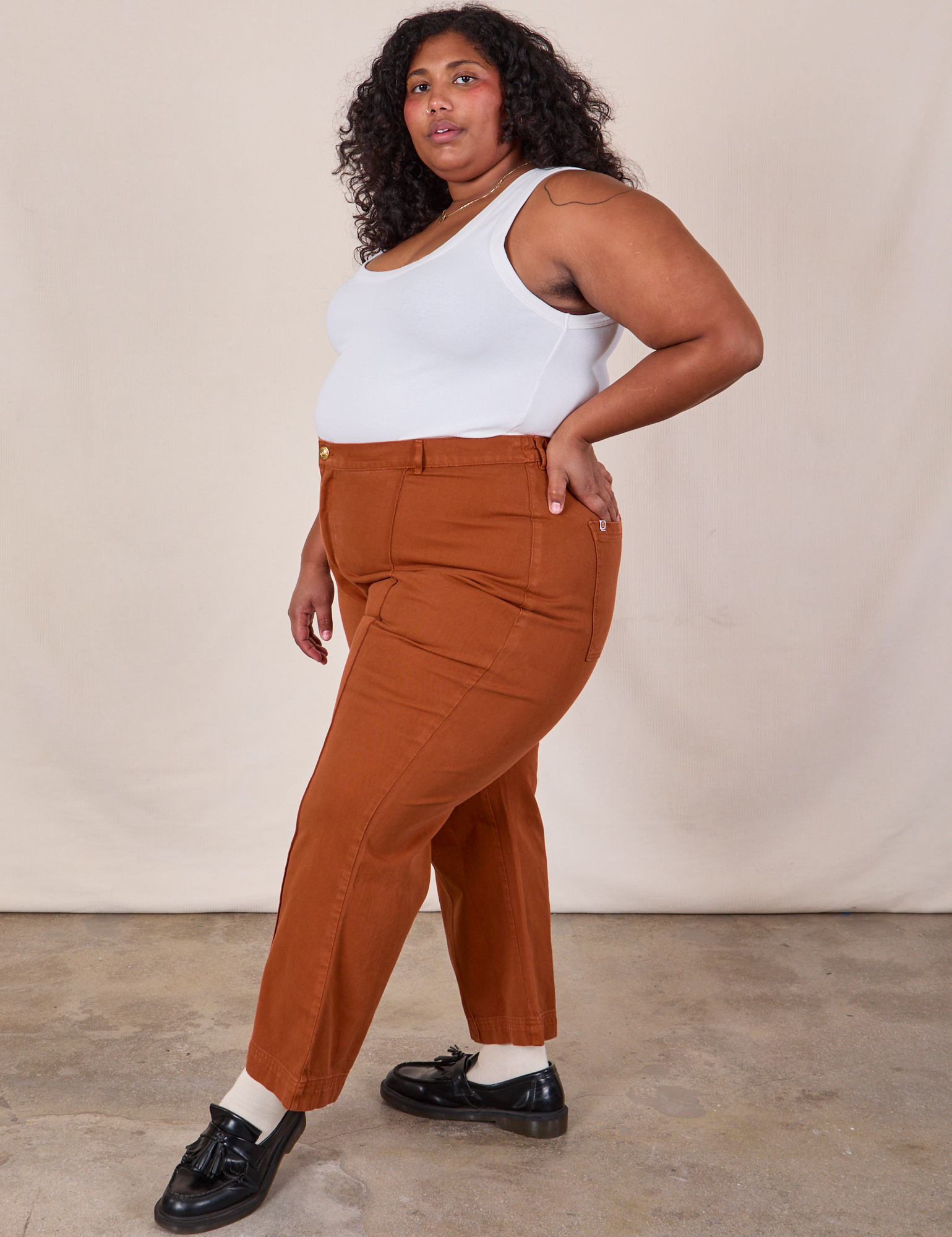 Side view of Western Pants in Burnt Terracotta and Cropped Tank in Vintage Tee Off-White on Morgan