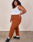 Side view of Western Pants in Burnt Terracotta and Cropped Tank in Vintage Tee Off-White on Morgan