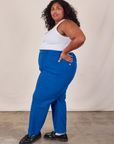 Side view of Western Pants in Royal Blue and Cropped Tank in Vintage Tee Off-White