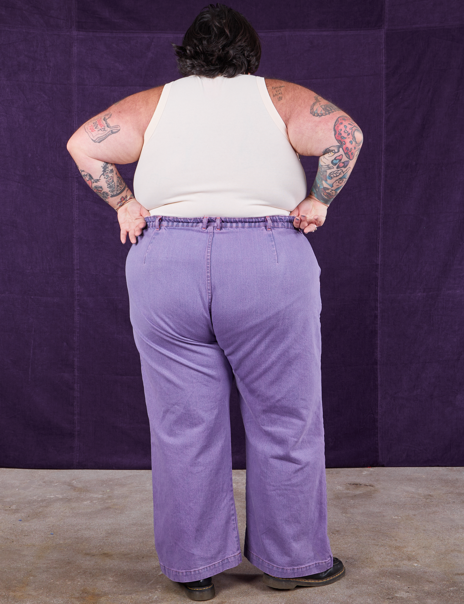 Back view of Overdyed Wide Leg Trousers in Faded Grape and vintage off-white Tank Top
