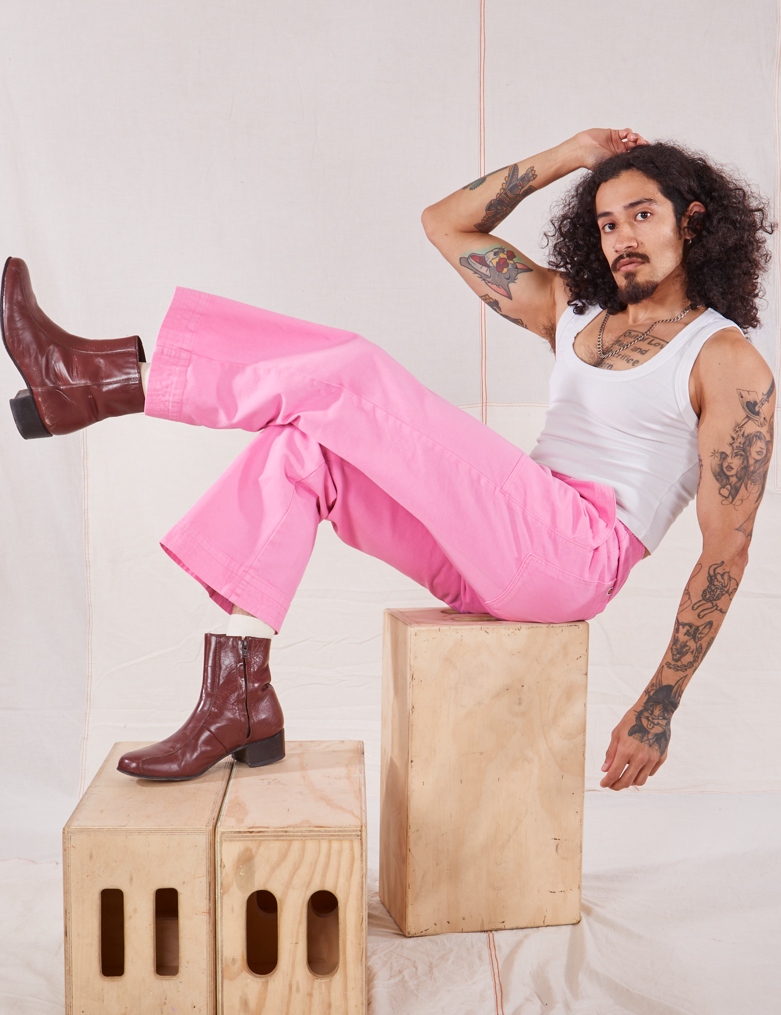 Jesse is wearing Action Pants in Bubblegum Pink and Cropped Tank in vintage tee off-white