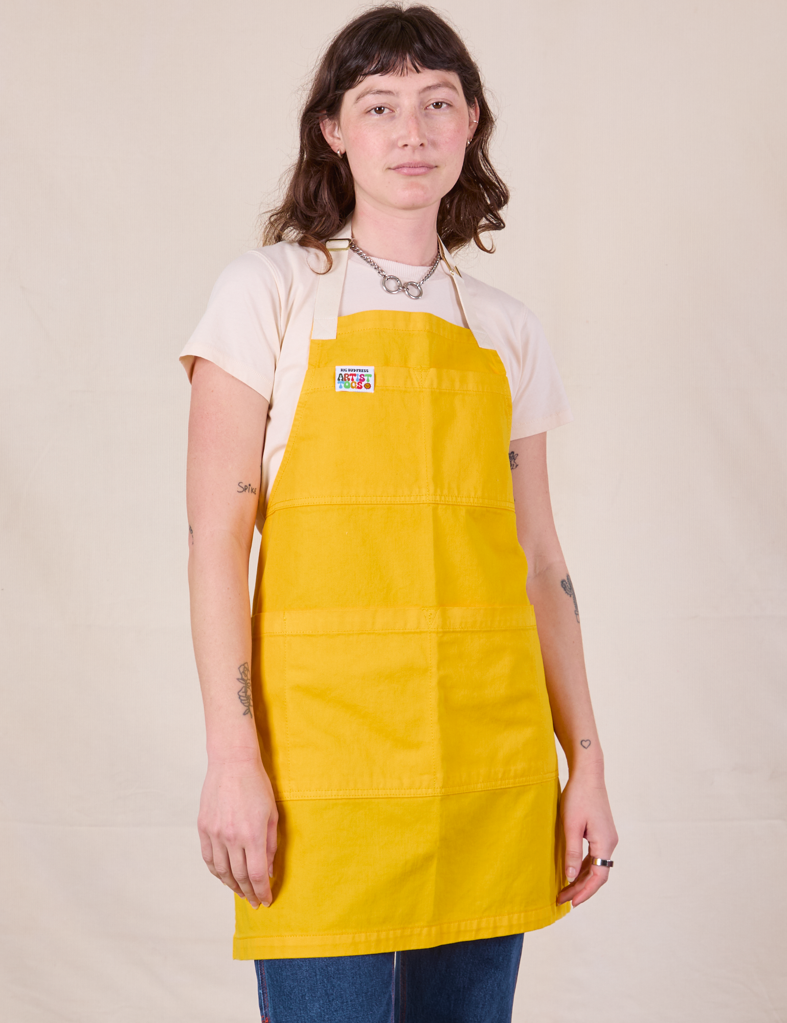 Full Denim Apron in Sunshine Yellow worn by Alex