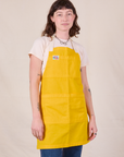 Full Denim Apron in Sunshine Yellow worn by Alex