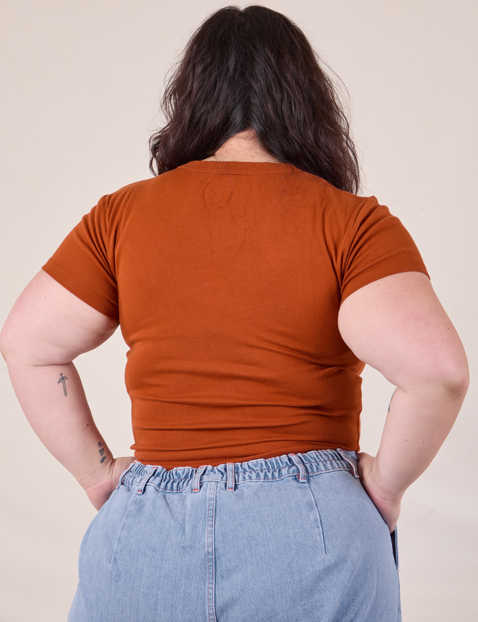 Baby Tee in Burnt Terracotta back view on Ashley