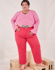 Sam is wearing Bell Sleeve Top in Bubblegum Pink and hot pink Work Pants