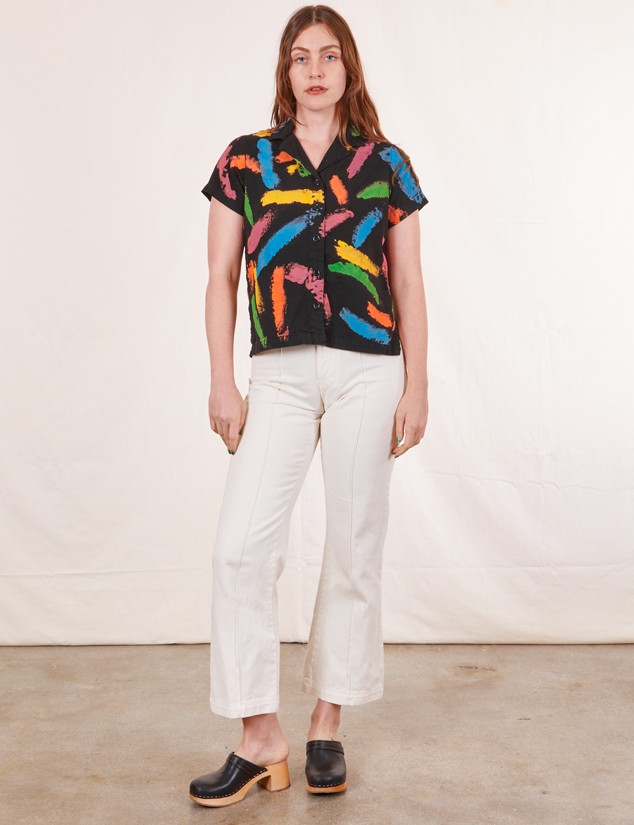 Allison is 5'10" and wearing XS Pantry Button Up in Paint Stroke paired with vintage off-white Western Pants