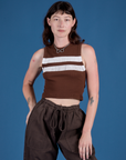 Alex is 5’8” and wearing P Painted Muscle Tee in Fudgesicle Brown