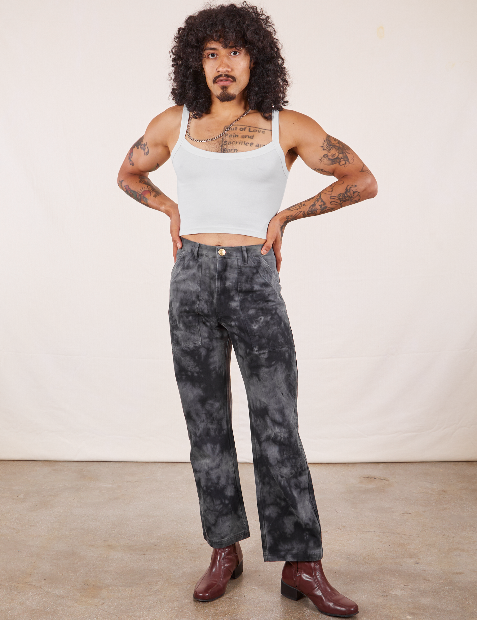 Jesse is 5&#39;8&quot; and wearing XS Black Magic Waters Work Pants paired with vintage off-white Cropped Cami