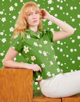 Margaret is wearing Pantry Button-Up in Bob Baker Flower