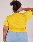 Burly Tee in Golden Yellow back view on Morgan