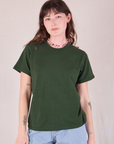 Alex is 5'8" and wearing P Burly Tee in Swamp Green