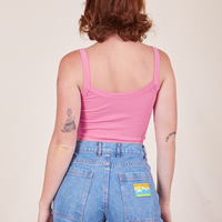 Back view of Cropped Cami in Bubblegum Pink and light wash Frontier Jeans worn by Alex