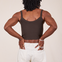 Back view of Cropped Cami in Espresso Brown and vintage off-white Western Pants worn by Jerrod