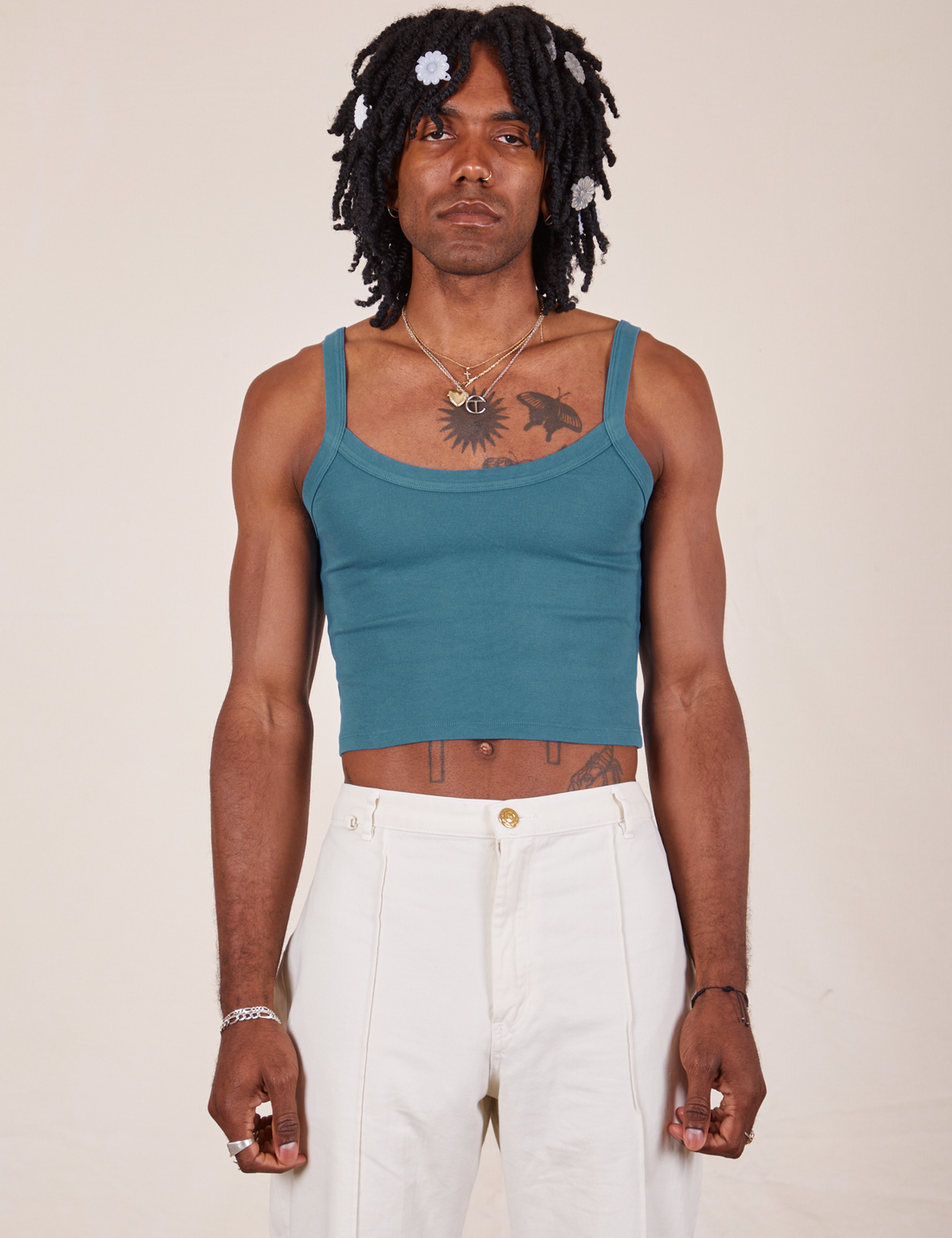 Jerrod is 6'3" and wearing S Cropped Cami in Marine Blue paired with vintage off-white Western Pants