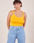 Tiara is 5'4" and wearing XS Cropped Cami in Sunshine Yellow paired with light wash Sailor Jeans