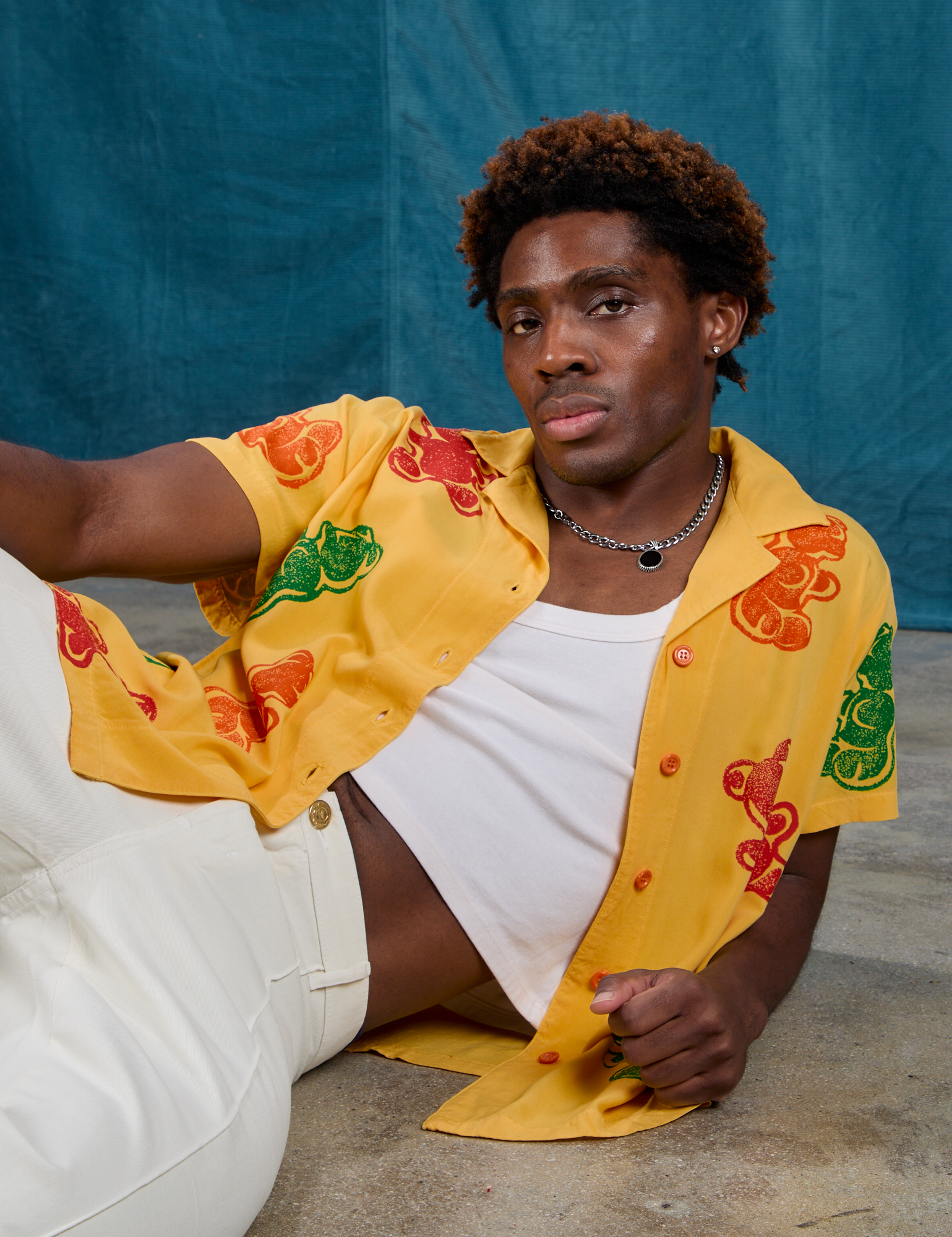 Isaac is wearing Gummy Bear Pantry Button-Up 