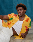 Isaac is wearing Gummy Bear Pantry Button-Up 