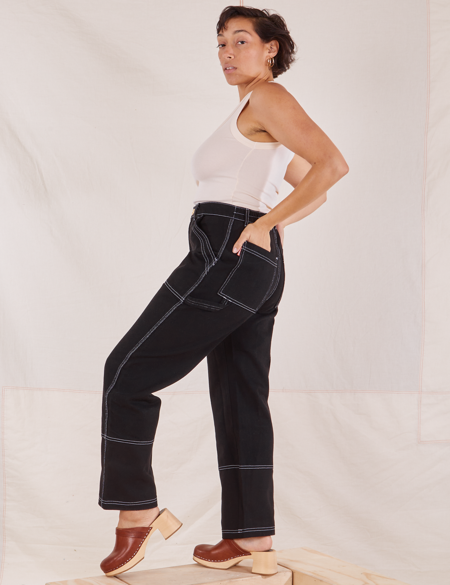 Side view of Carpenter Jeans in Black worn by Tiara