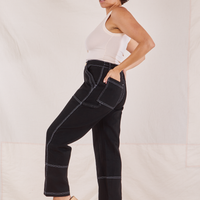 Side view of Carpenter Jeans in Black worn by Tiara