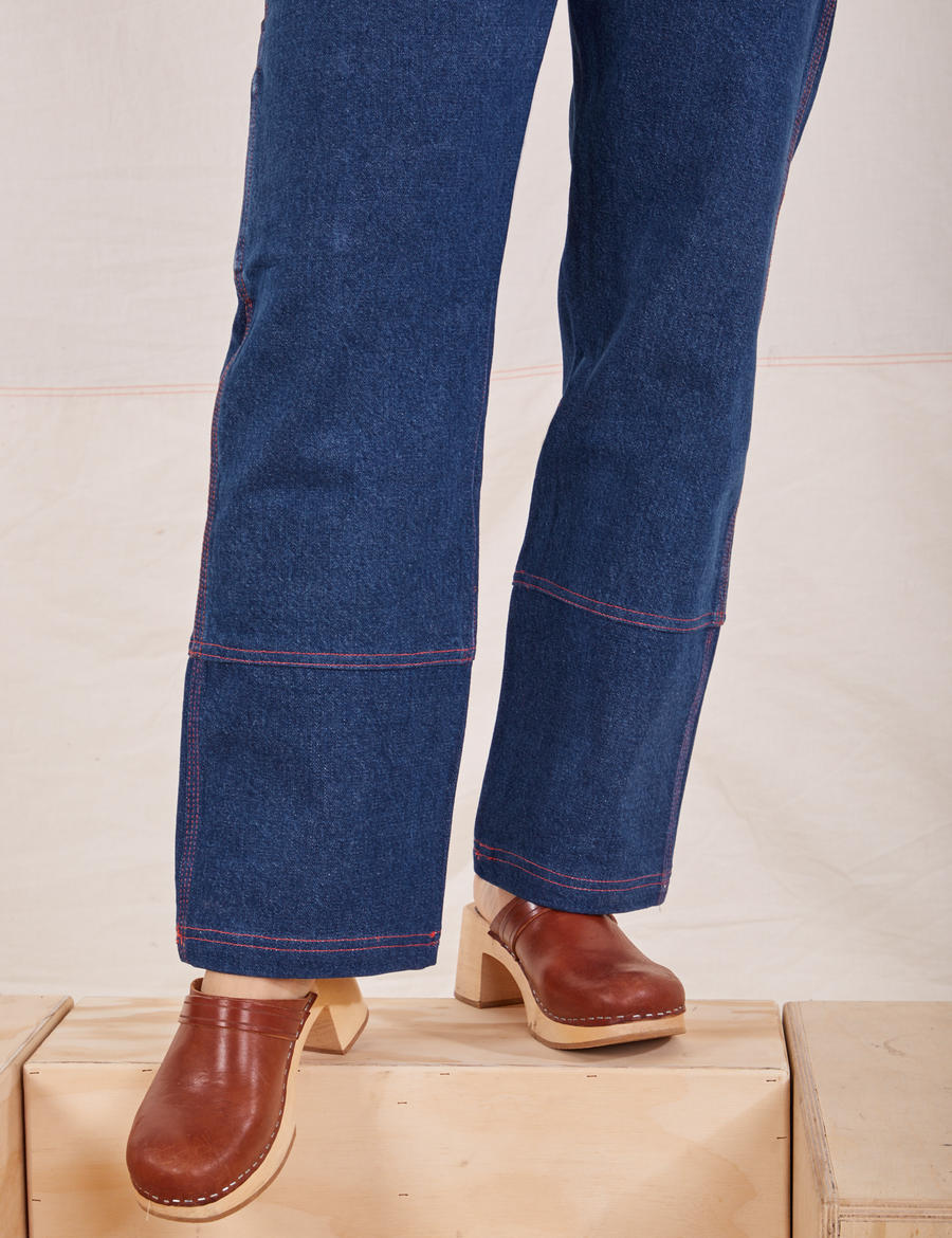Carpenter Jeans in Dark Wash pant leg close up worn by Tiara