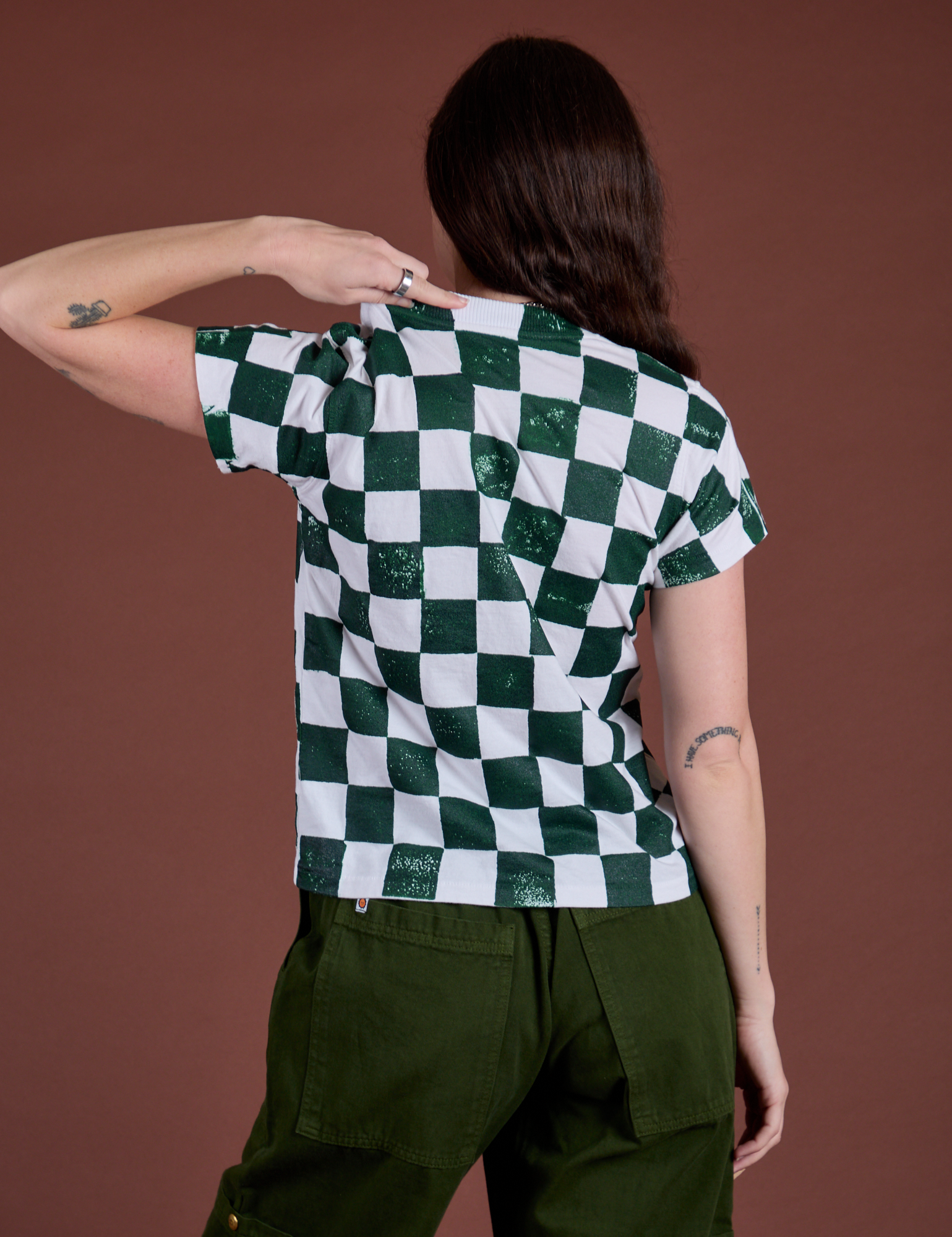 Checker Organic Tee in Swamp Green back view on Alex