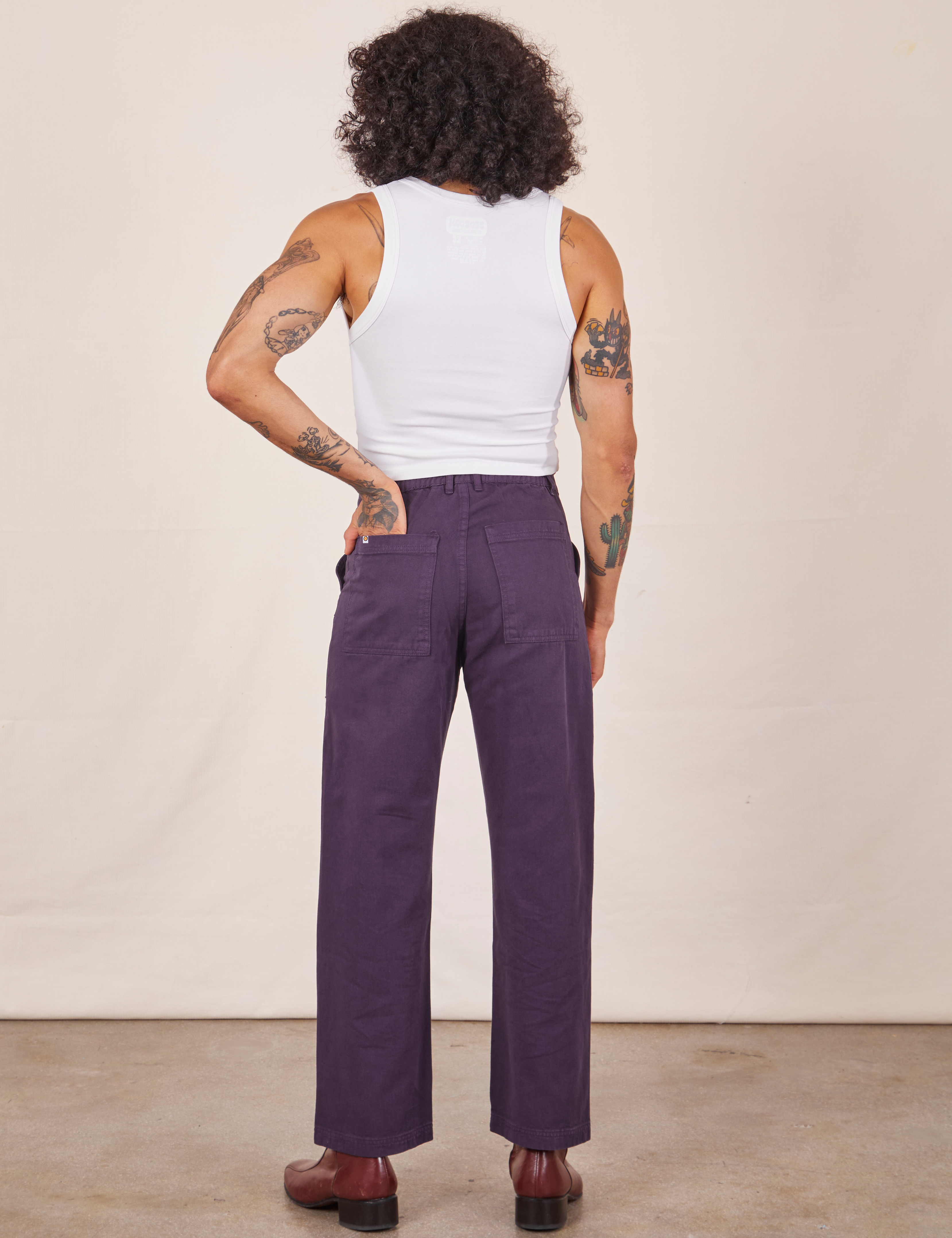 Back view of Work Pants in Nebula Purple worn by Jesse
