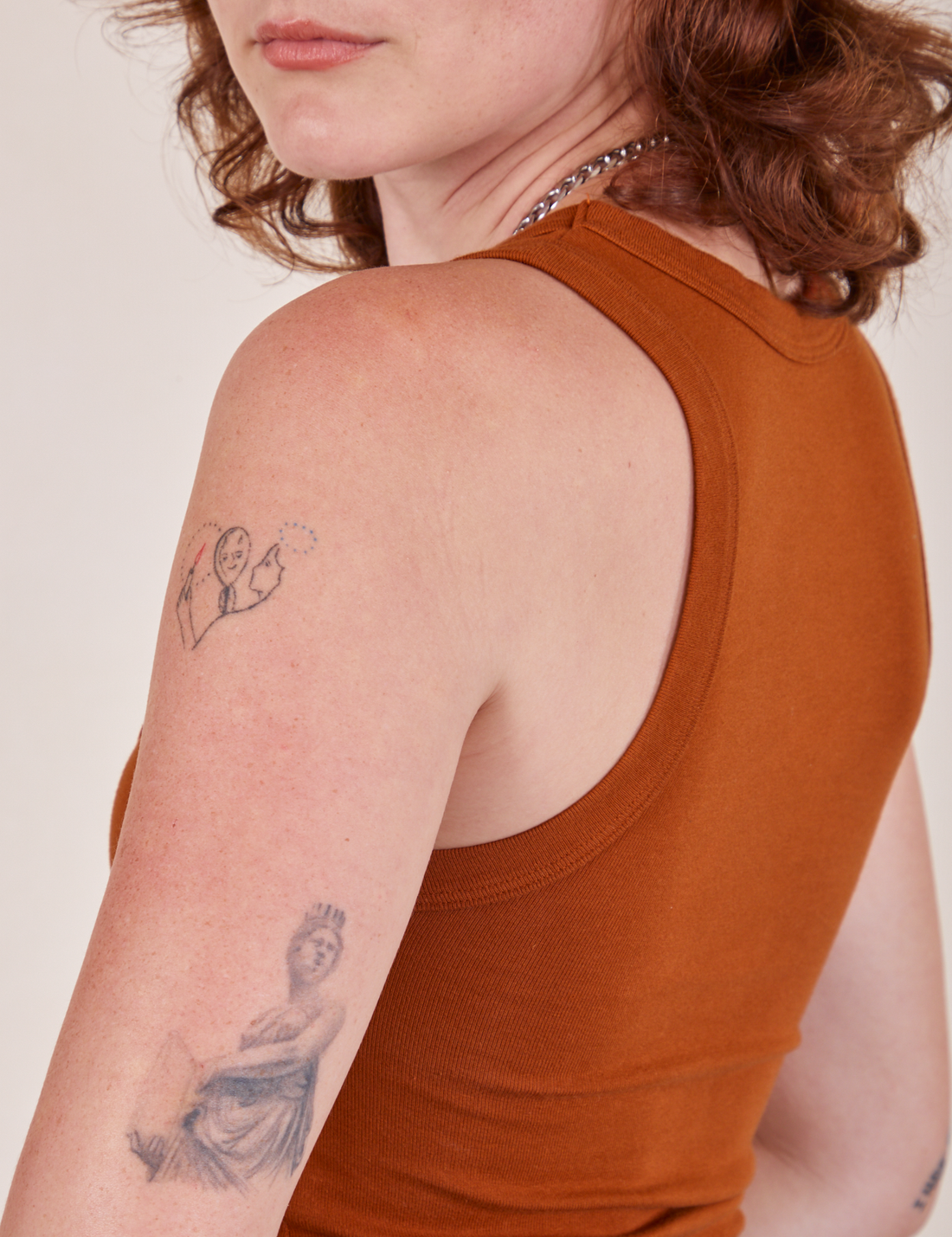 Side view of Cropped Tank Top in Burnt Terracotta worn by Alex