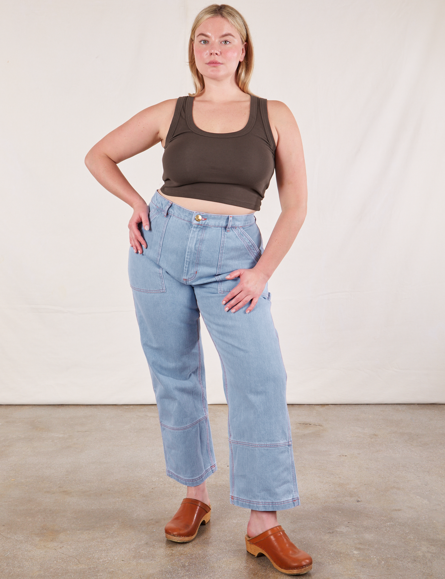 Lish is wearing Cropped Tank Top in Espresso Brown and light wash Carpenter Jeans