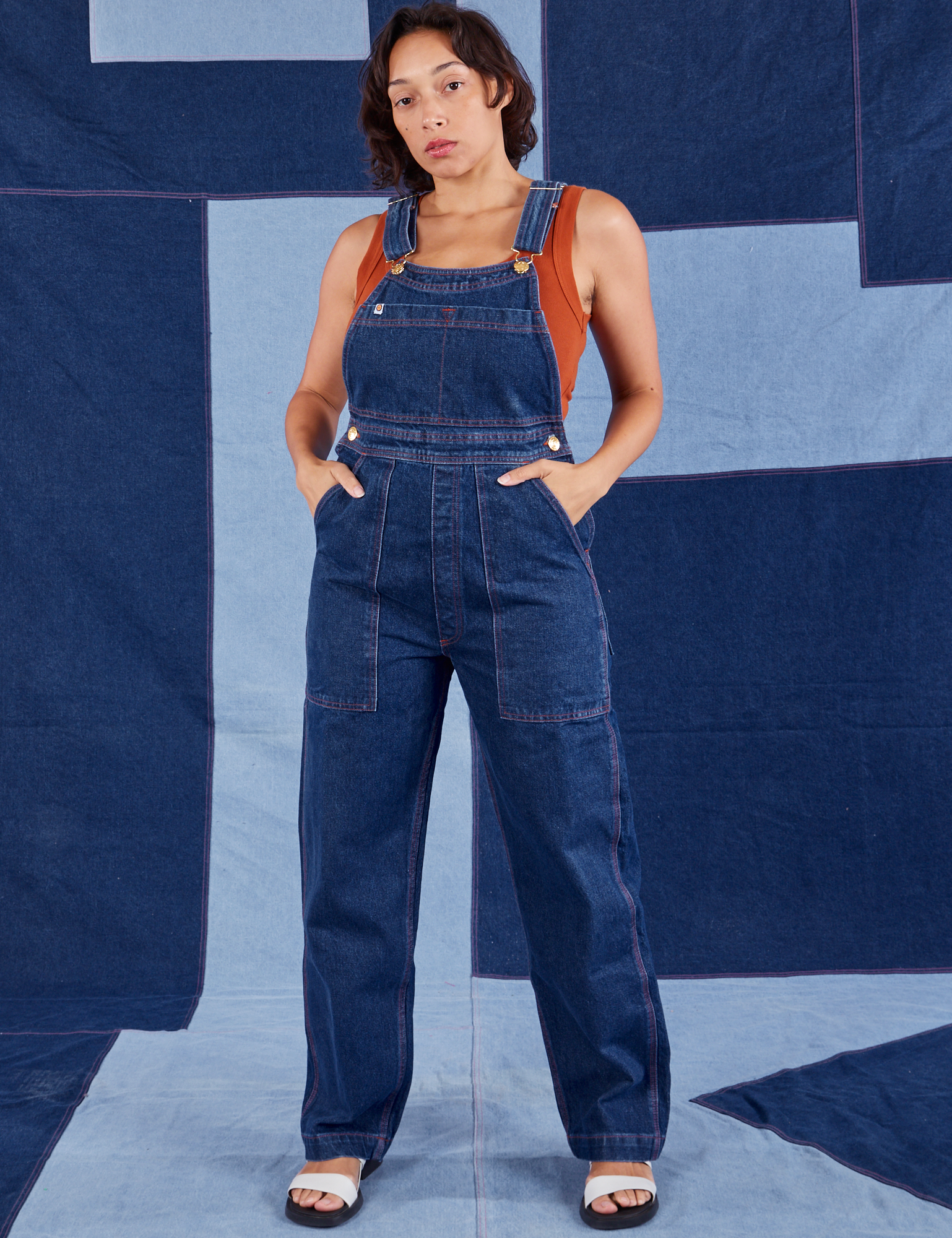 Tiara is 5&#39;4&quot; and wearing XS Indigo Denim Original Overalls in Dark Wash