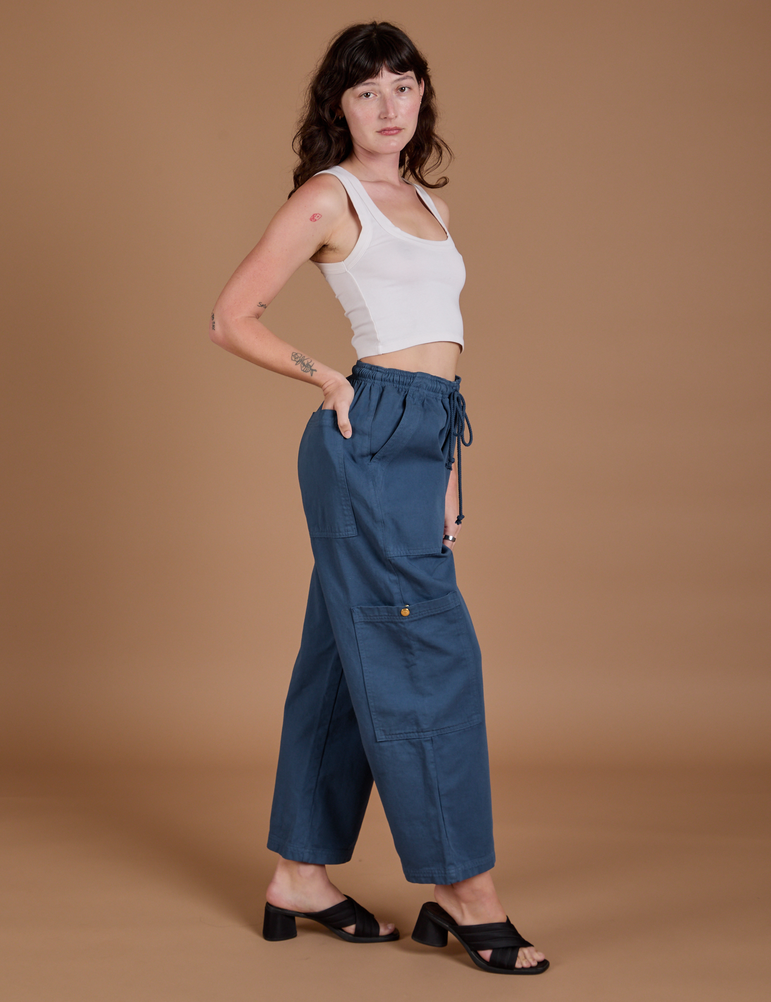 Side view of Drop Pocket Cargo Pants in French Blue and Cropped Tank in vintage tee white