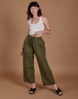 Alex is 5’8” and wearing XXS Drop Pocket Cargo Pants in Surplus Green paired with a Cropped Tank in Vintage Tee White