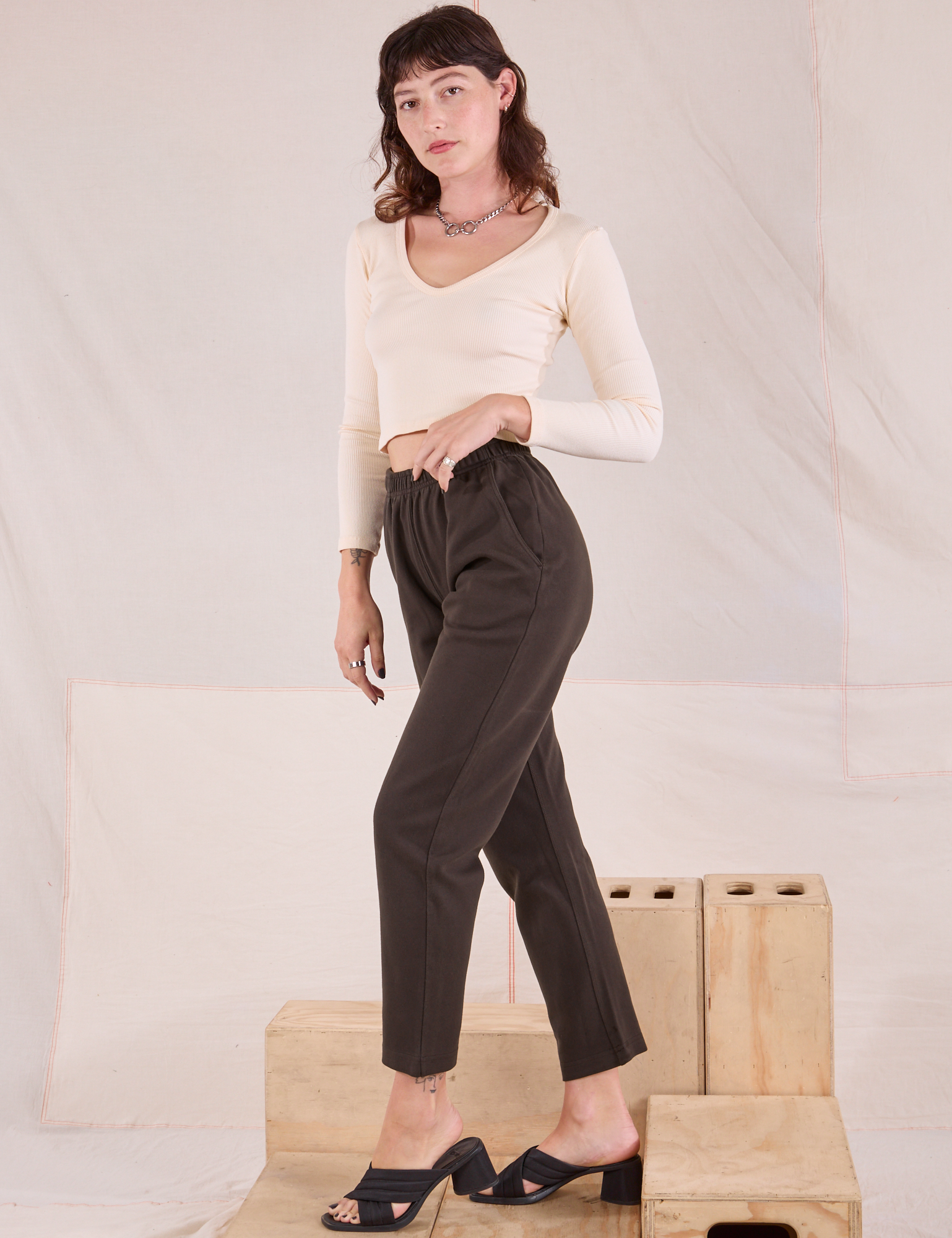 Side view of Easy Pants in Espresso Brown and vintage tee off-white Long Sleeve V-Neck Tee