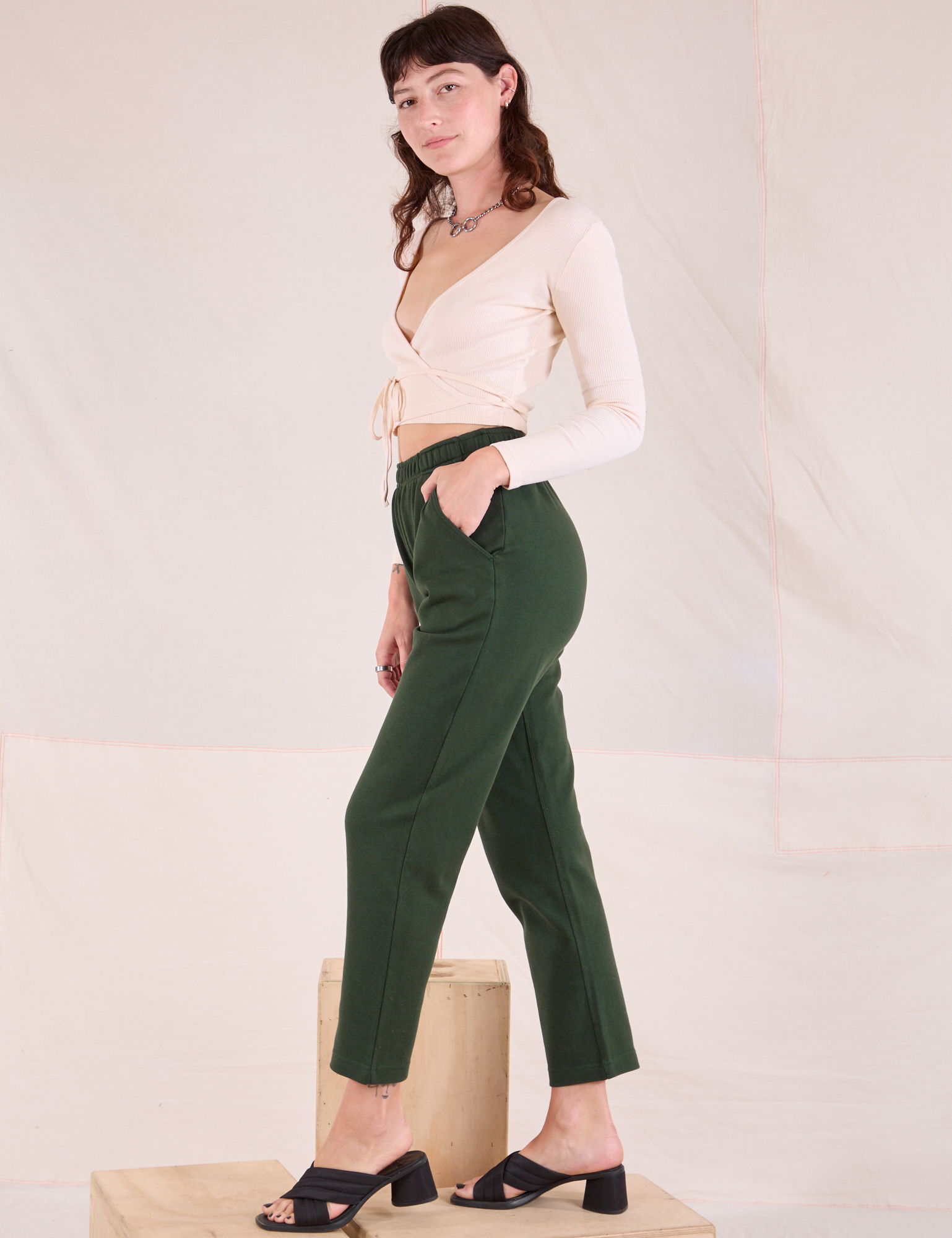 Side view of Easy Pants in Swamp Green and vintage tee off-white Wrap Top