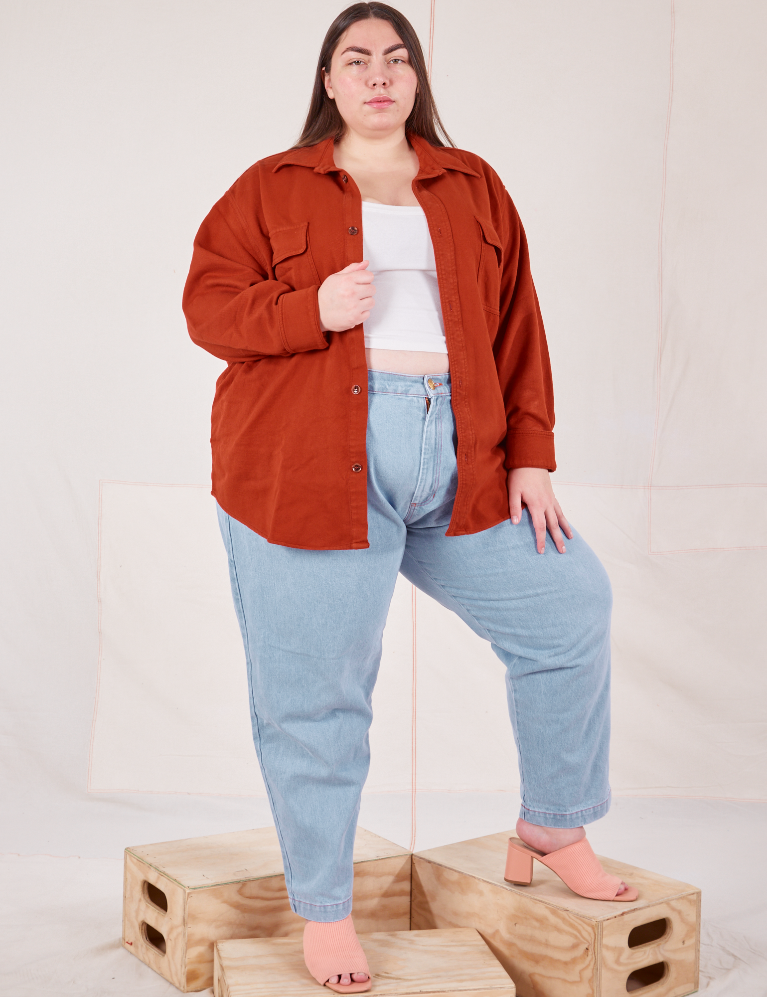 Marielena is wearing Flannel Overshirt in Paprika and light wash Trouser Jeans