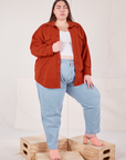 Marielena is wearing Flannel Overshirt in Paprika and light wash Trouser Jeans