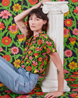 Alex is wearing Flower Tangle Pantry Button-Up