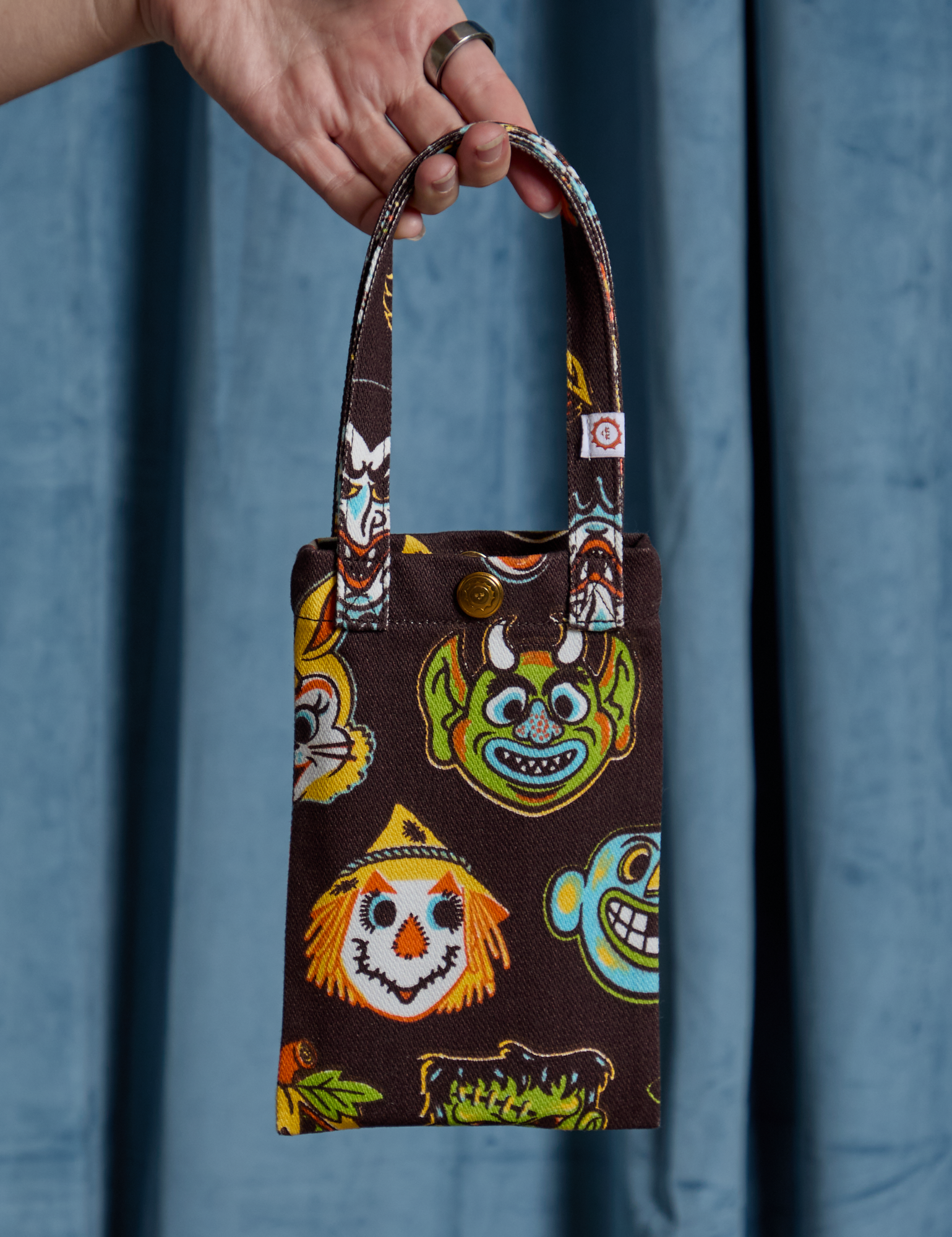 Halloween Masks Cell Phone Tote held by Alex