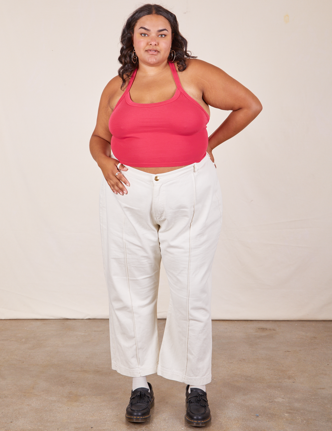 Alicia is wearing Halter Top in Hot Pink and vintage off-white Western Pants