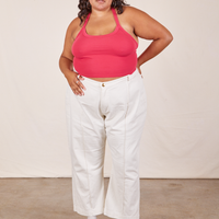 Alicia is wearing Halter Top in Hot Pink and vintage off-white Western Pants