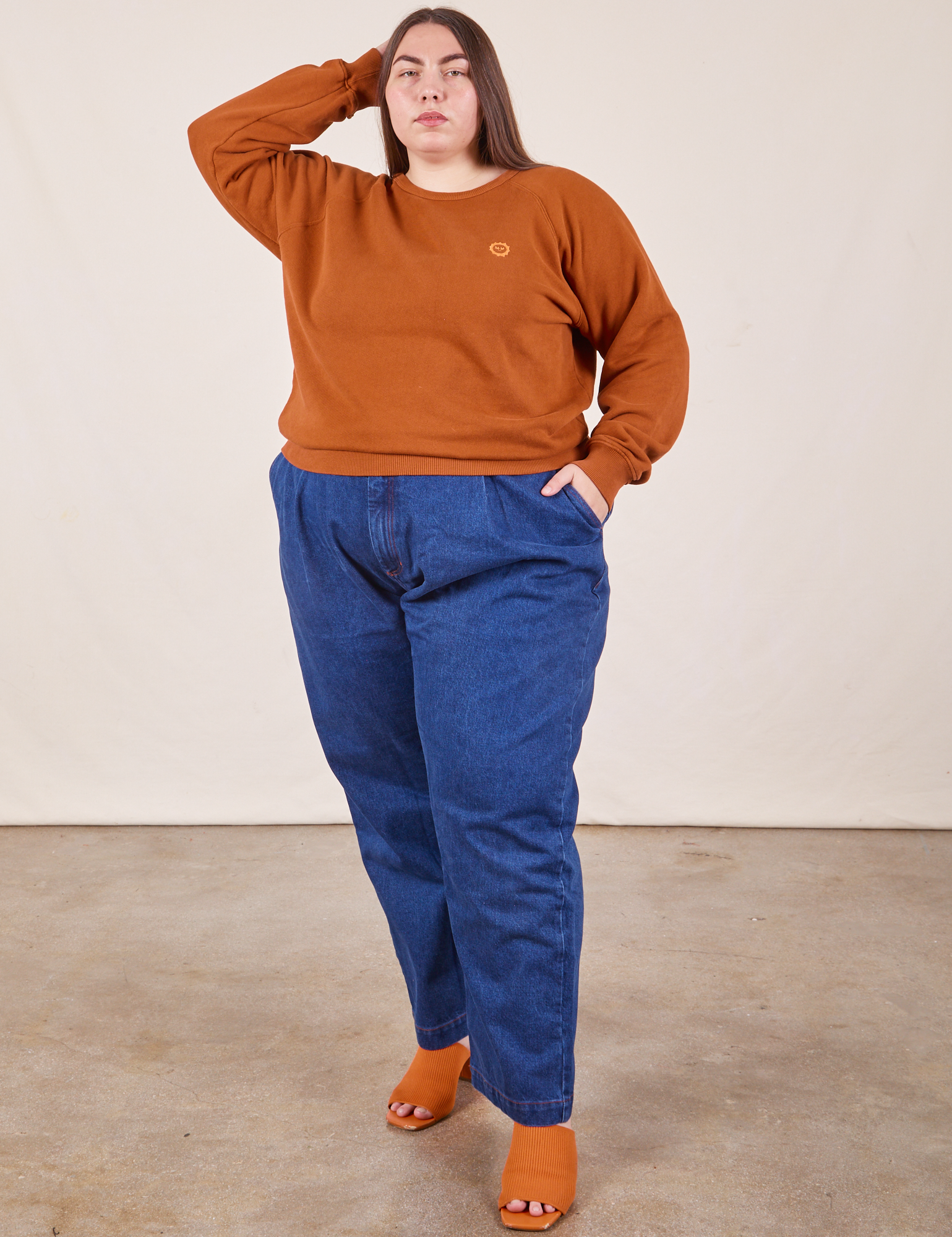 Marielena is wearing L Heavyweight Crew in Burnt Terracotta paired with dark wash Denim Trouser Jeans