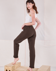 Angled back view of Rolled Cuff Sweat Pants in Espresso Brown and vintage off-white Cropped Tank on Alex